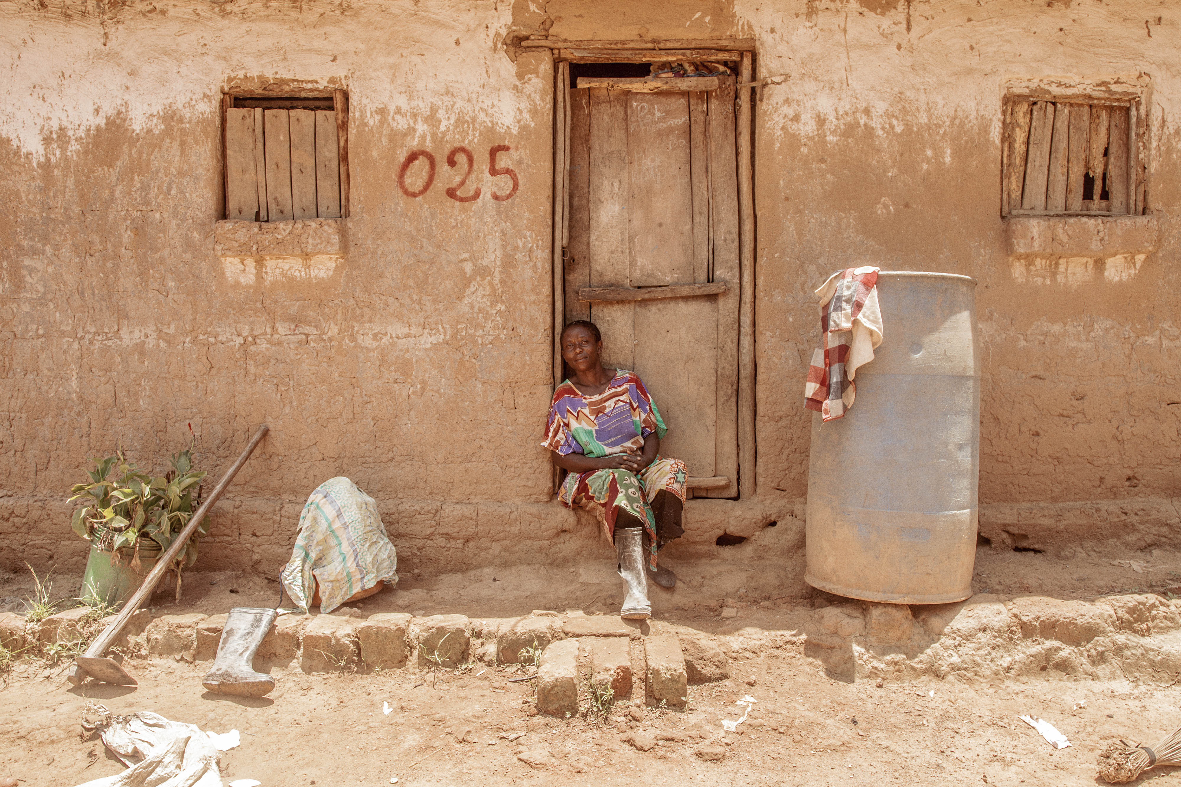 A woman sitting in a doorway