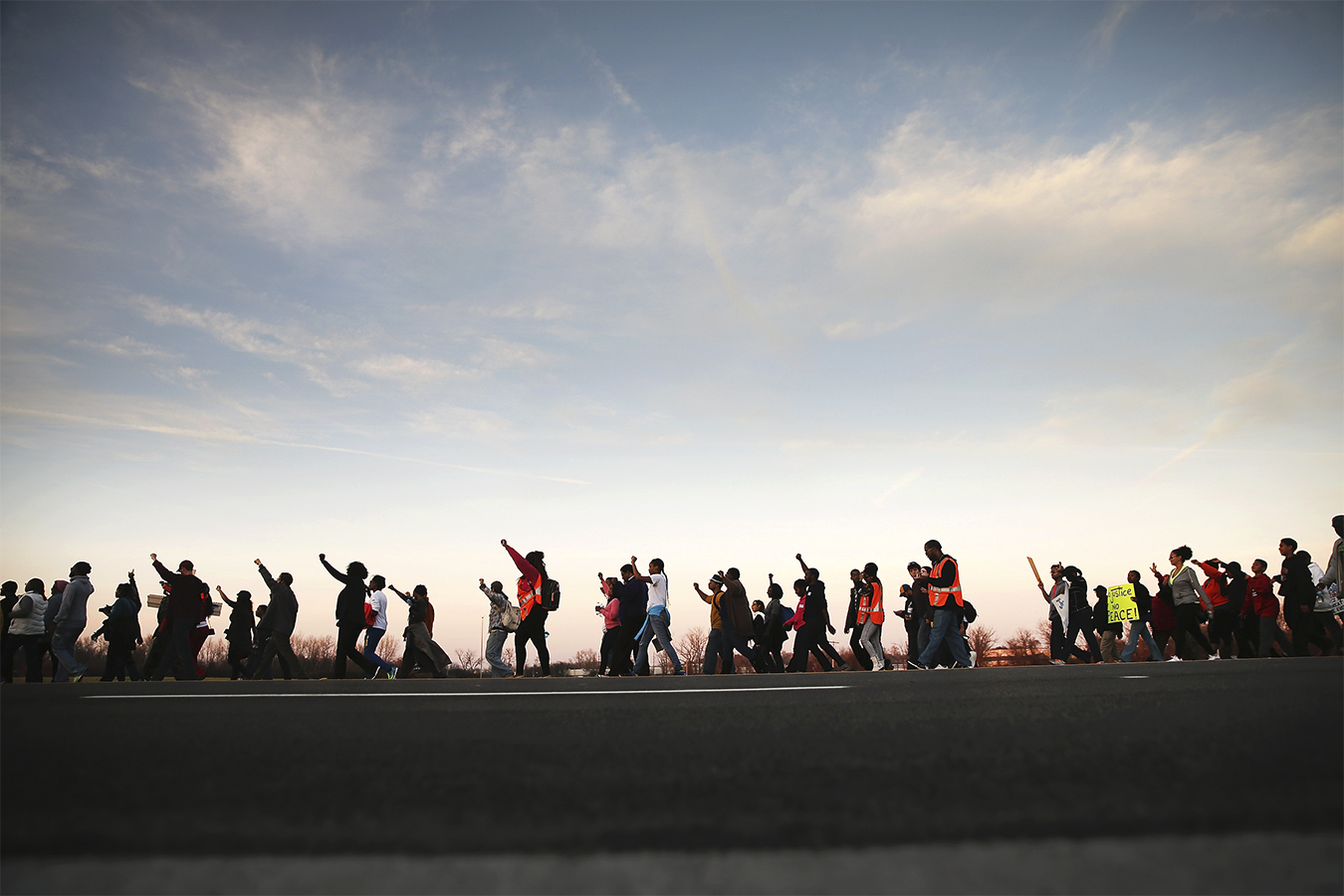 People march along road