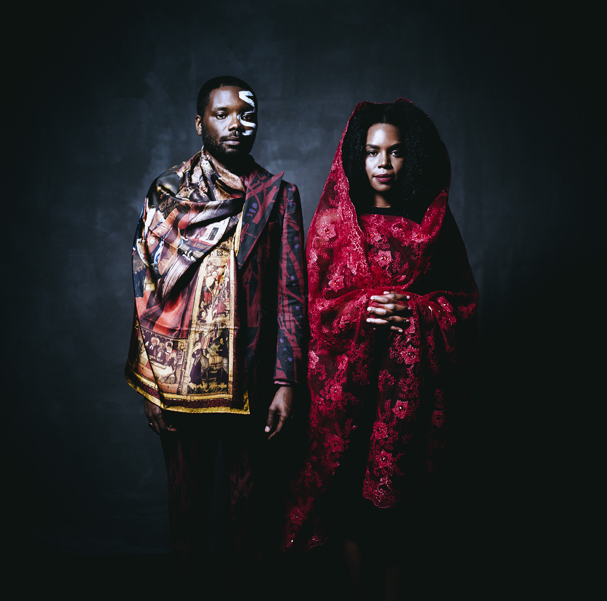 A man and woman photographed in a studio