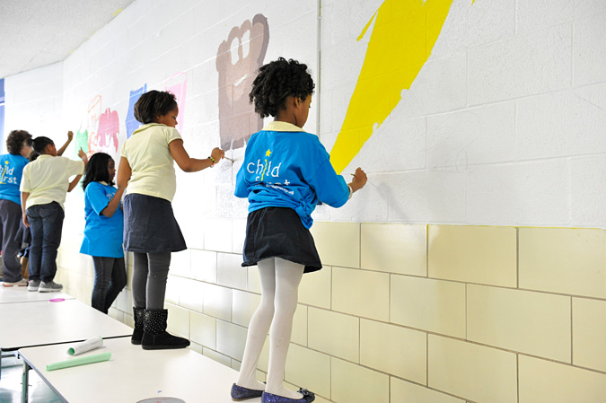 Kids painting on the wall