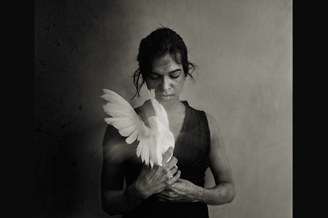 Woman holding a dove