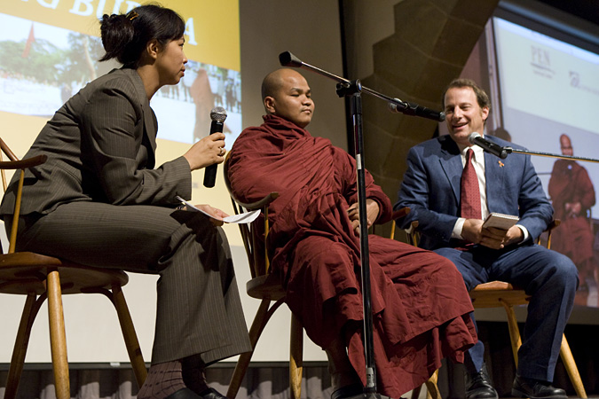Translator, Venerable U Gawsita, and George Packer sitting with microphones