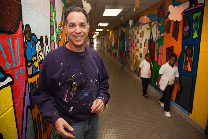 Jay Wolf Schlossberg-Cohen standing in a hallway