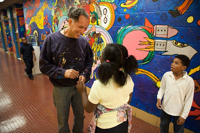 Jay Wolf Schlossberg-Cohen talking to kids in hallway