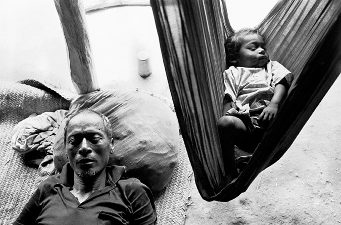 Man sleeping next to baby