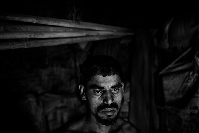 A man stares in the dark