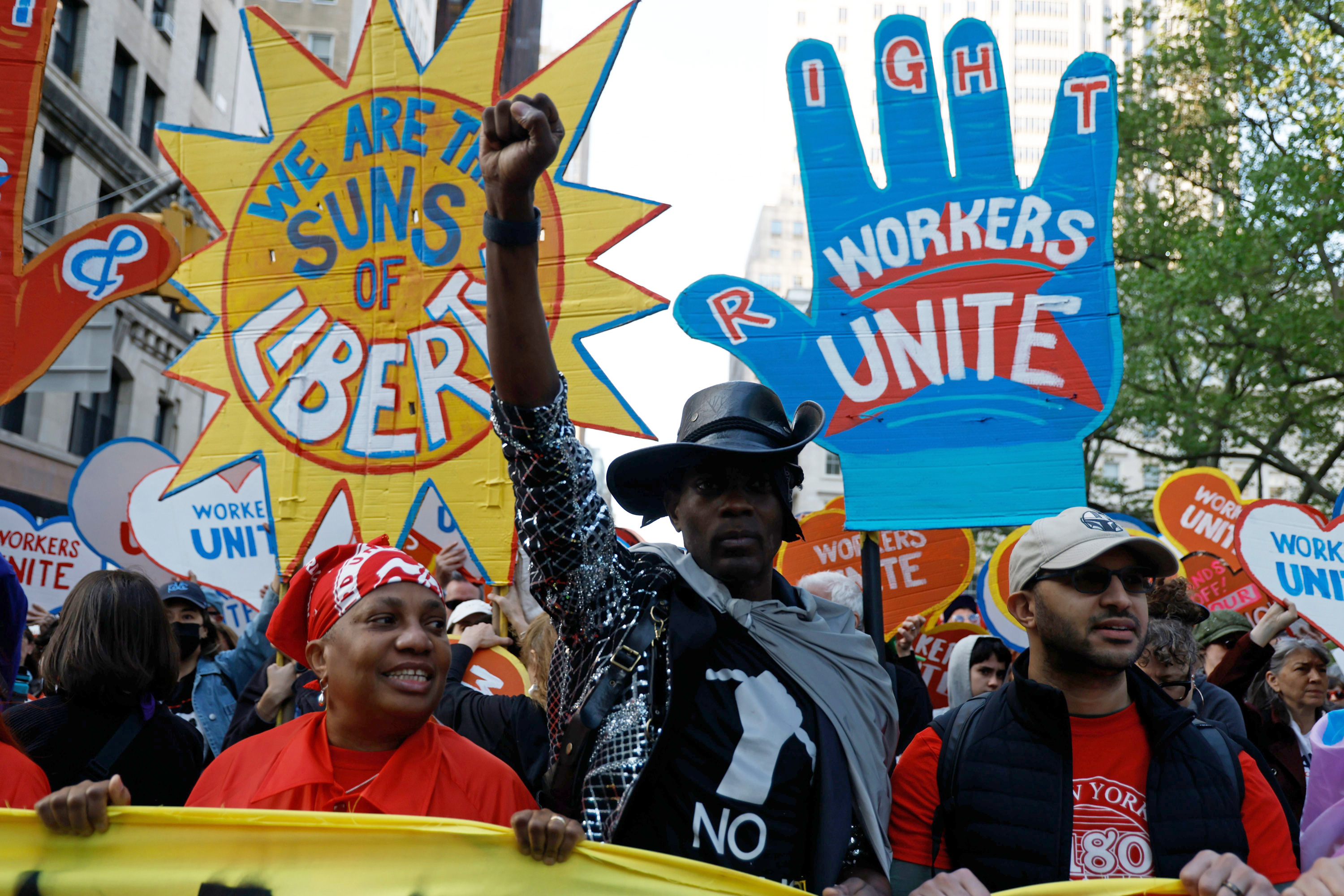 People marching holding signs