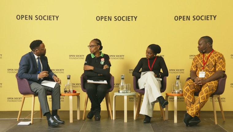 Yemi Adamolekun, Habiba Ahut Daggash, Cheta Nwanze, and Tomi Oladipo sitting on a stage.