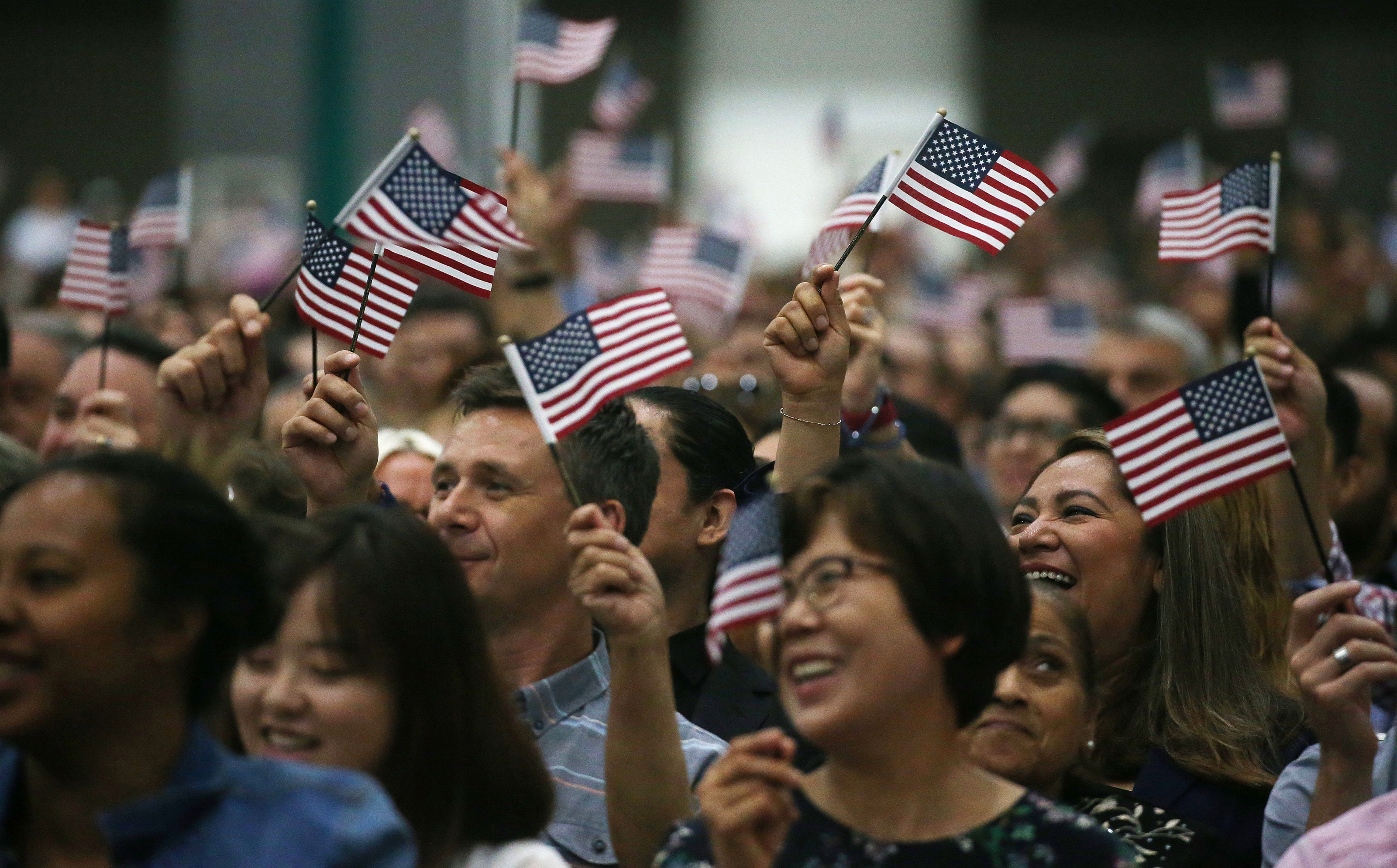 People waving American flags
