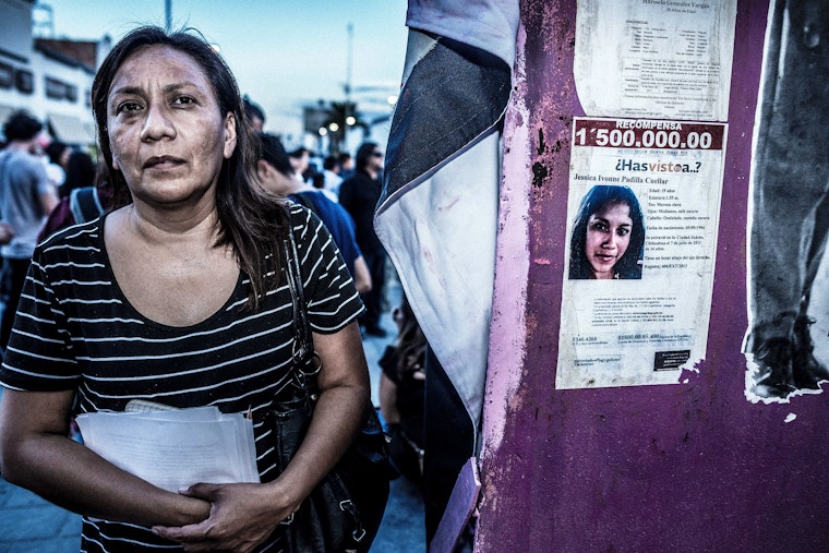 A reporter for the newspaper El Diario in Cuidad Juarez, Mexico. Photo credit: © Timothy Fadek/Redux A woman stands next to a missing-person poster in Cuidad Juarez, Mexico.