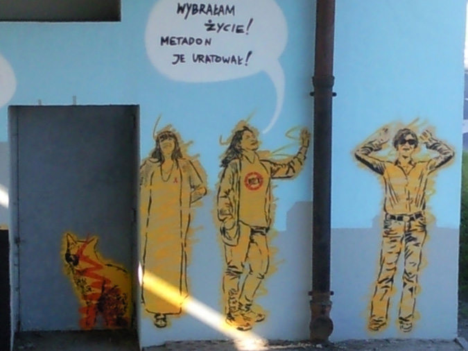 Grafitti on a wall of three people