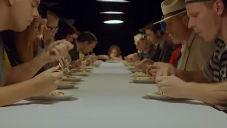 People eating at a long table