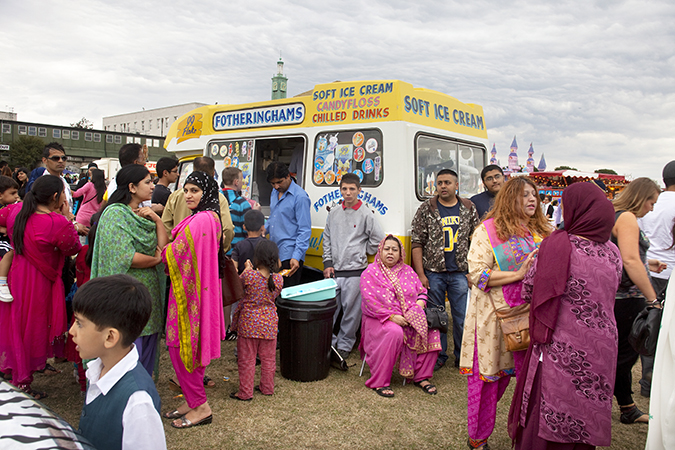 A gathering in front of an ice cream truck