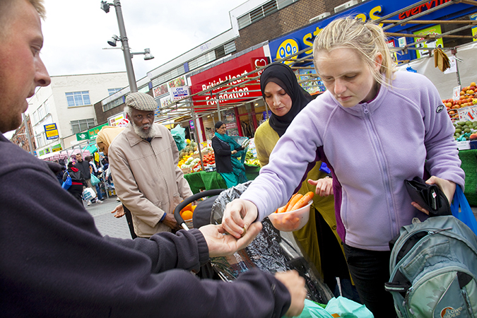 A woman paying a vendor