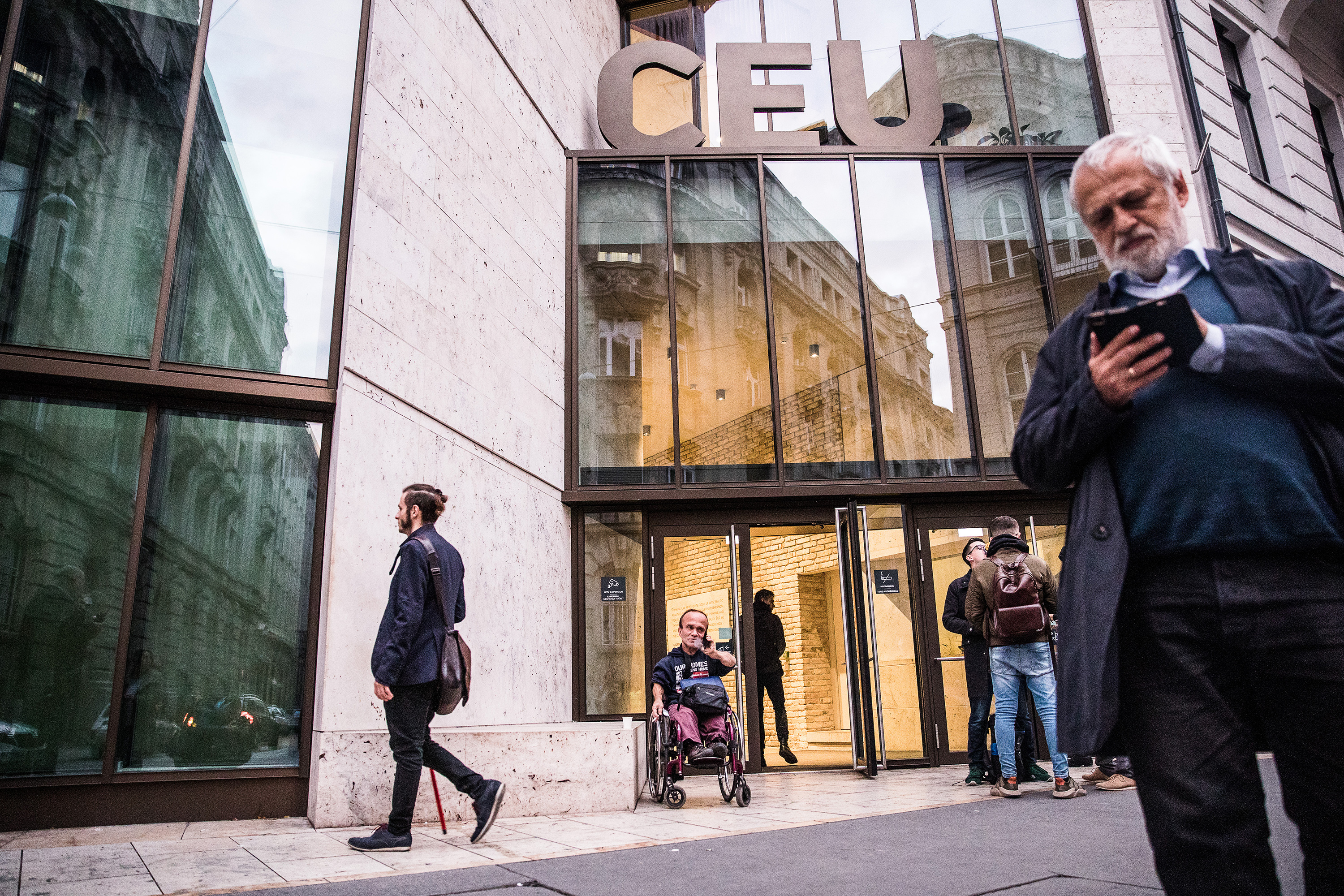 People outside the entrance to Central European University in Budapest, Hungary.