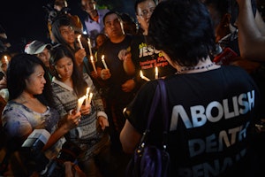 Protestors lighting candles