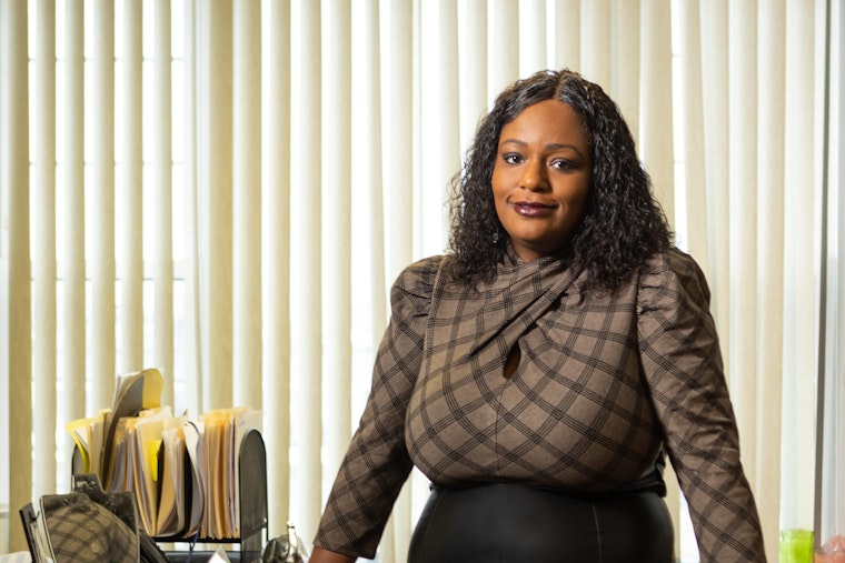Franchelle Parker, executive director of Open Buffalo, in her office. Open Buffalo is a civic initiative to make significant, long-term investments in Buffalo to increase equity and social justice. “We probably held two dozen teach-ins, and they were standing room only,” Parker says of the organizing work Open Buffalo accomplished in the Fruit Belt. Photo credit: © Douglas Levere for the Open Society Foundations Francelle Parker at a desk in her office