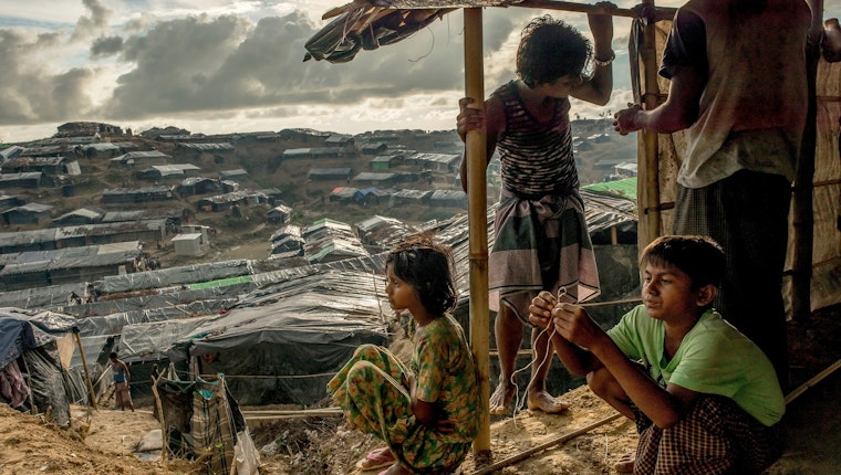 A family in a makeshift tent