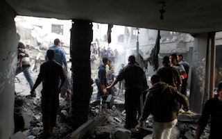 People walking among rubble of a destroyed building