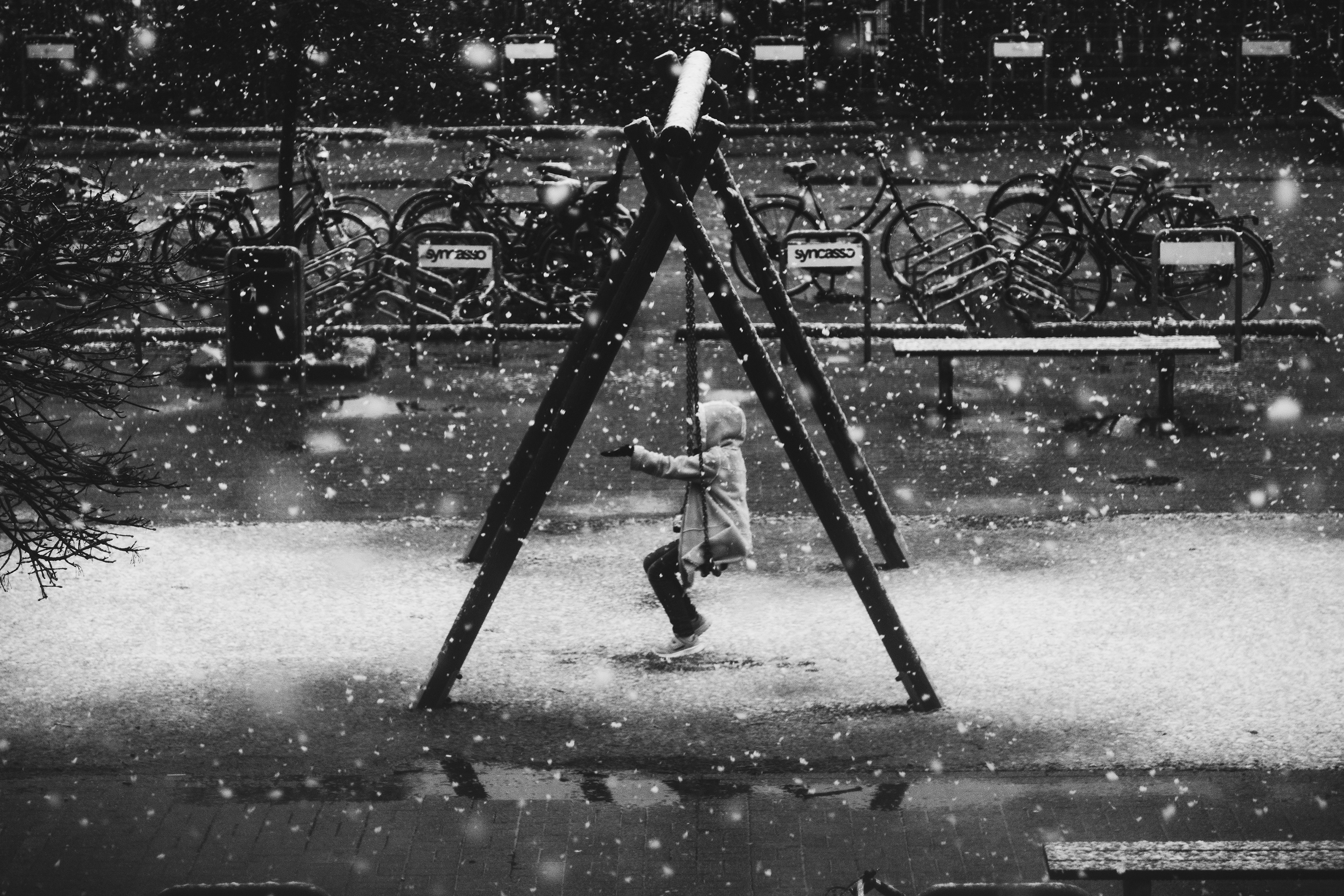 a girl on a swing in the snow