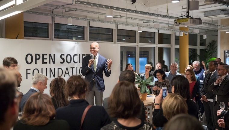 Open Society President Patrick Gaspard speaking at a reception