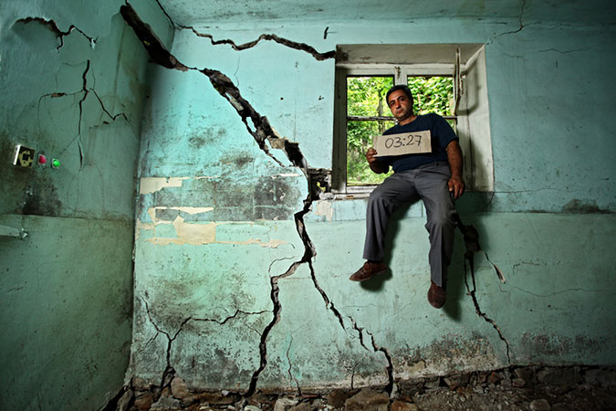 Man sitting on a window sill.