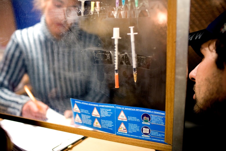 A client is pictured speaking with a healthcare professional at a needle exchange program at the Humanitarian Action Fund's mobile clinic in St. Petersburg, Russia. Needle exchange programs provide sterile injection equipment, including needles, alcohol pads, and clean water for injections, as well as condoms, HIV testing and other medical services, and social counseling. Photo credit: © Lorena Ros for the Open Society Foundations A client is pictured speaking with a healthcare professional at a needle exchange program at the Humanitarian Action Fund's mobile clinic in St. Petersburg, Russia. Needle exchange programs provide sterile injection equipment, including needles, alcohol pads, and clean water for injections, as well as condoms, HIV testing and other medical services, and social counseling.