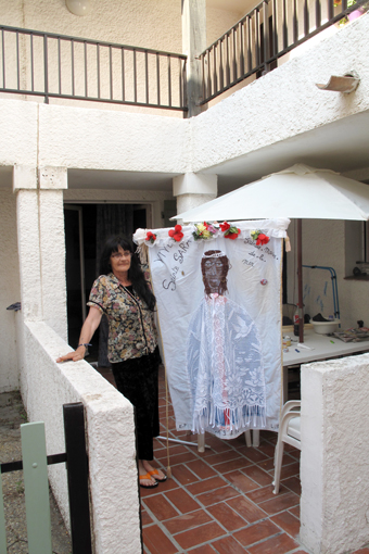 A woman holding a banner