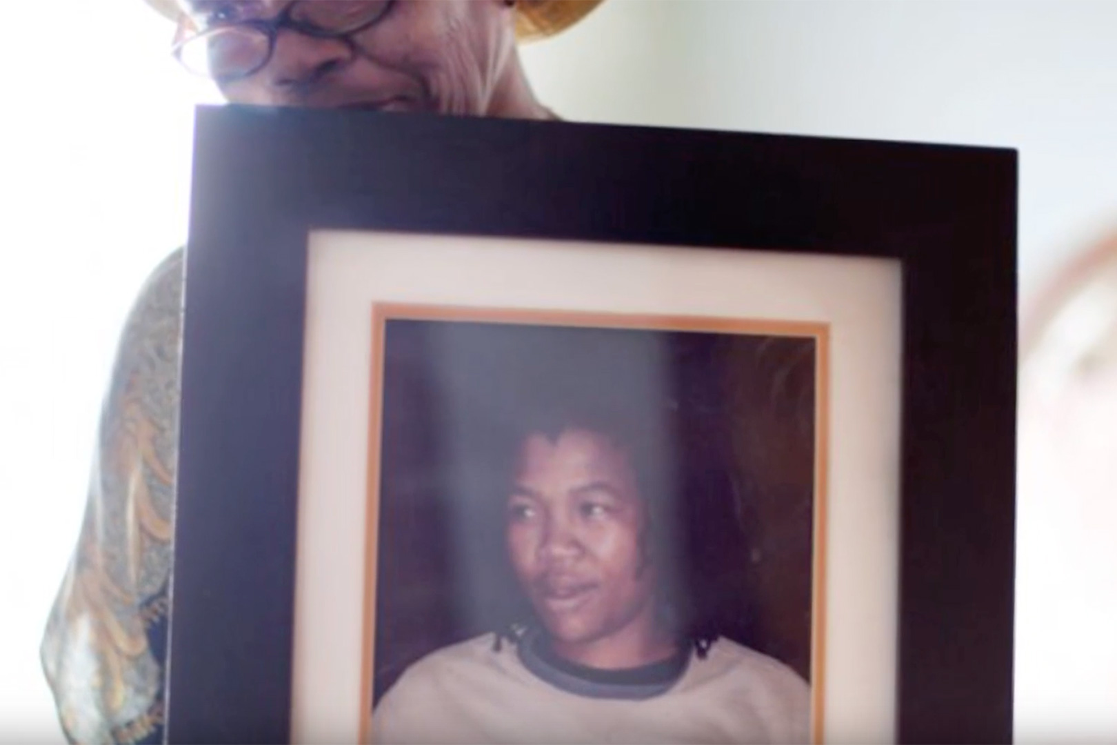 Woman holding a framed photo