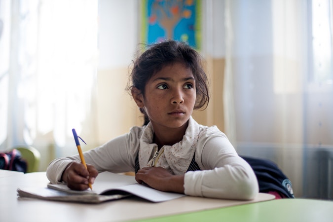 A pupil in one of the local schools in Frumusina, Romania. The Roma Education Fund—supported by the World Bank, Open Society Foundations, the European Union, and other donors—is working there to remove the barriers local Roma children face to complete their primary school education. Photo credit: © Bjorn Steinz/Panos Pictures for the Open Society Foundations A school girl studying
