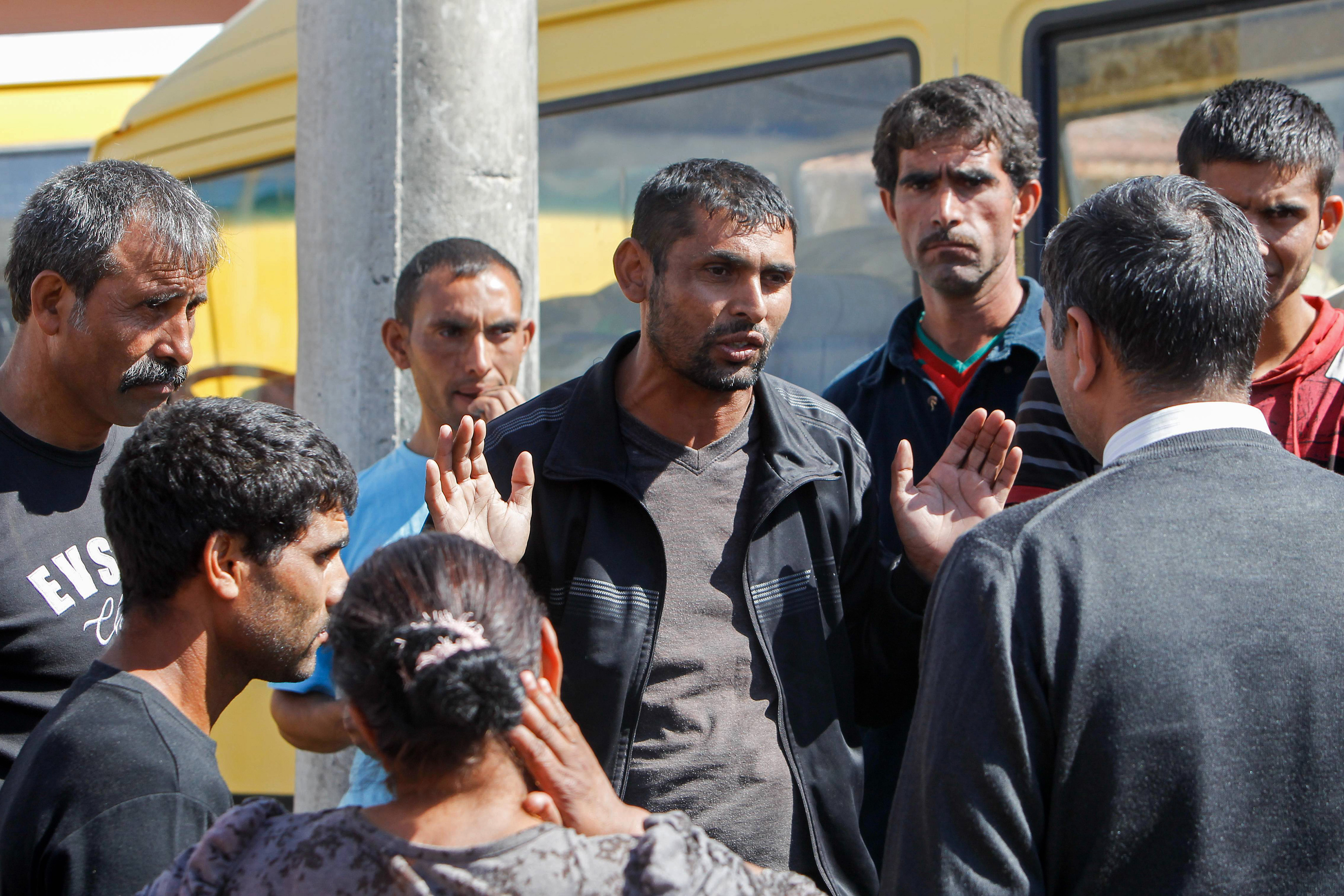 A group of men in discussion