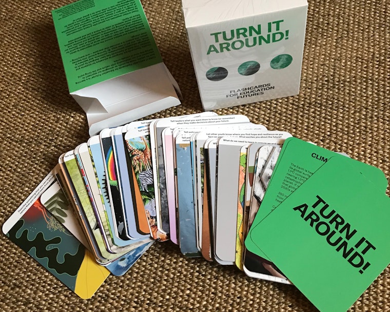 A stack of cards, with "Turn it Around!" on one