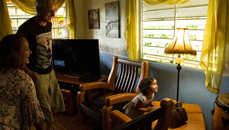 A family looking at a lamp