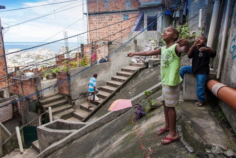 Children standing on pavement