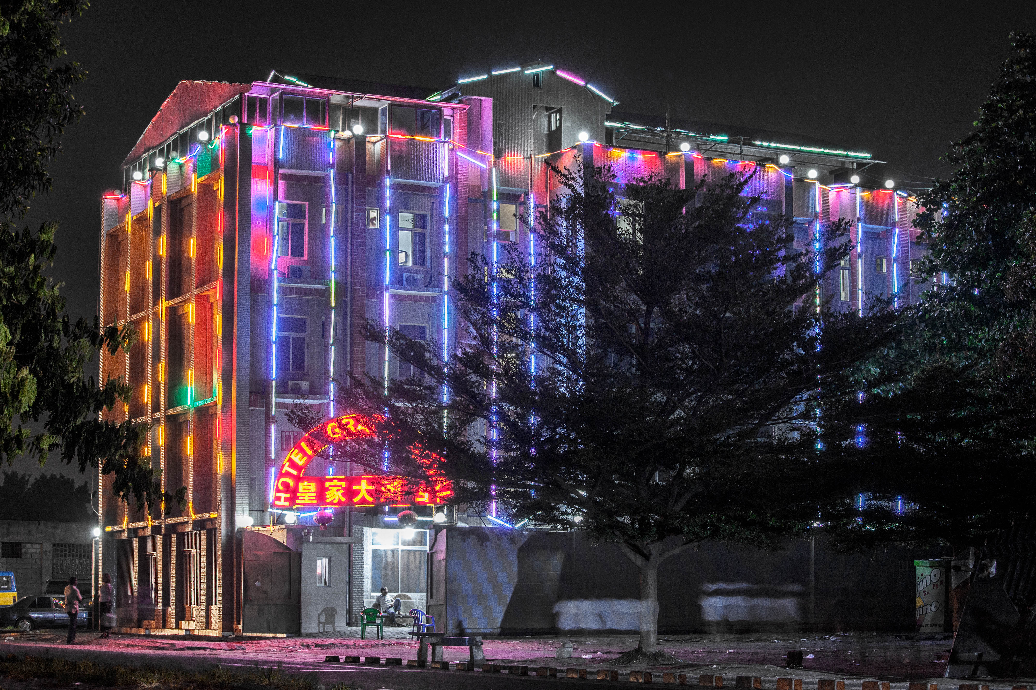 A colorful hotel at night