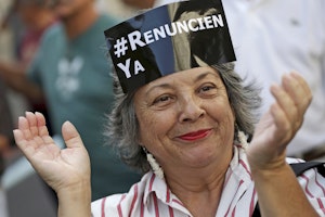 A woman with a sign on her forehead