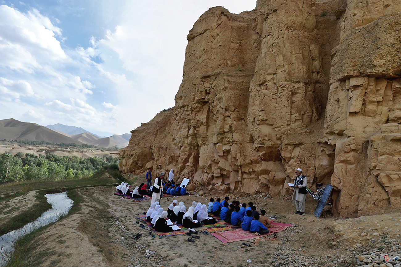 Boys and girls in class outside