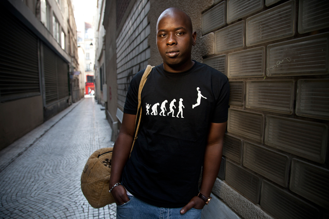 A man leaning against a wall