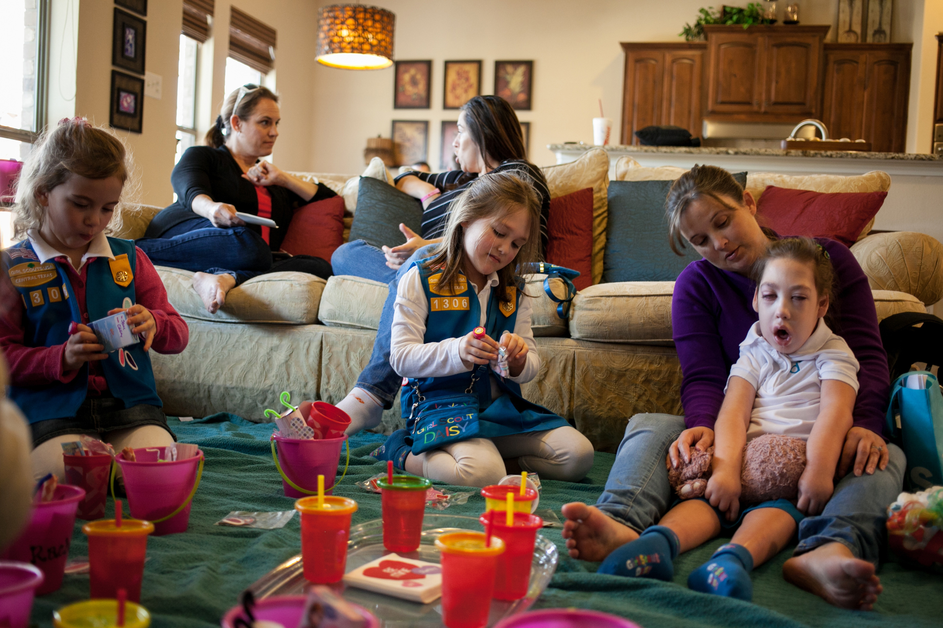 Girl and mothers in a living room