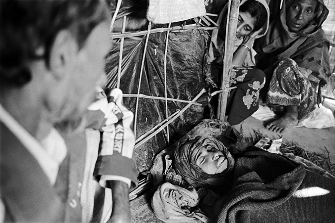 People looking at a dead teenager.