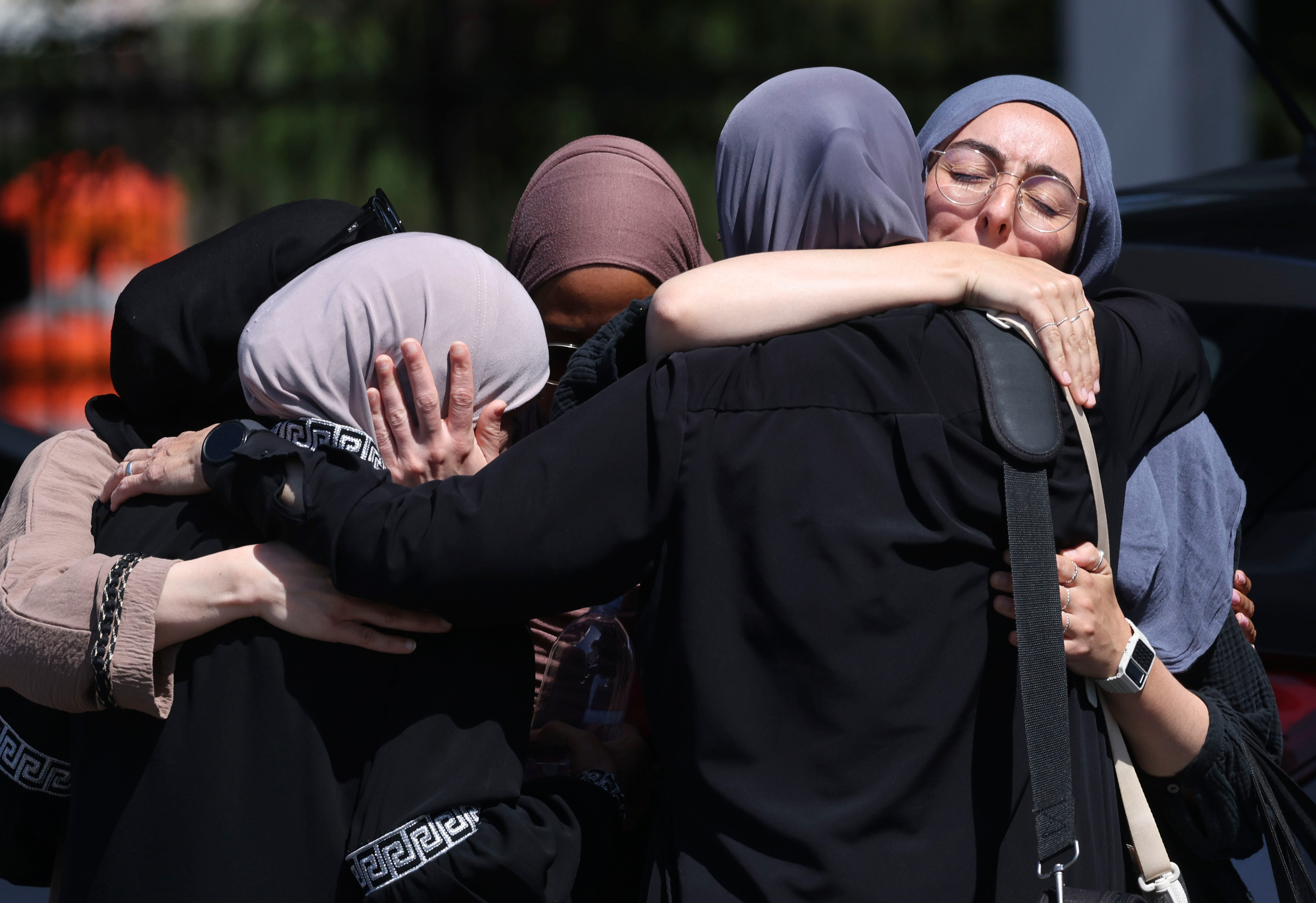 Four people embracing