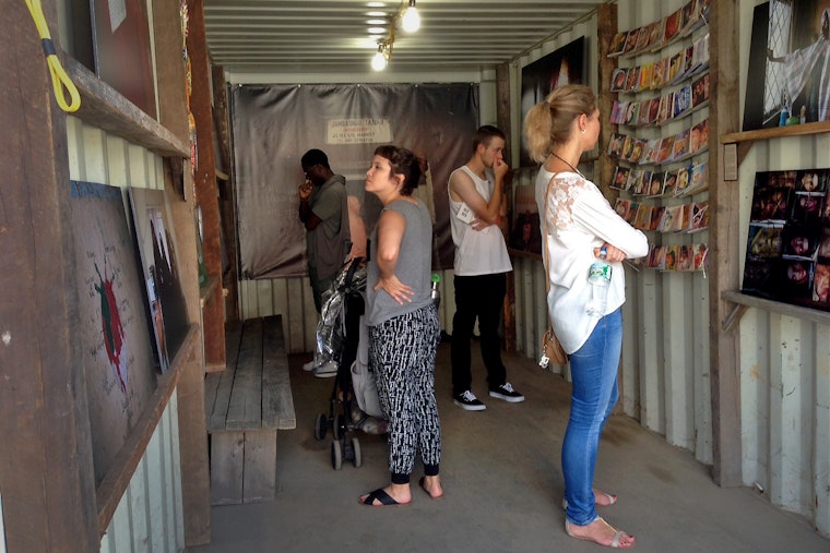 People viewing artwork at Photoville