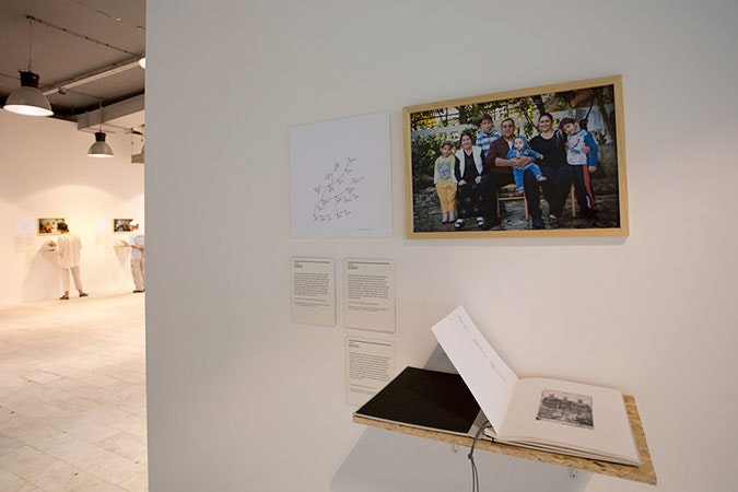 The Roma Family Album Exhibition which ran in Belgrade between September 10 and 17. A contemporary photo of the families involved was taken and is seen here mounted on the wall. The accompanying material includes photos from the family's own album along with accompanying written material. Photo credit: © Ana Adamovic Exhibit in Belgrade about family albums.