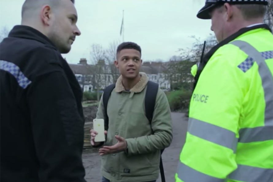 A young man and two police officers