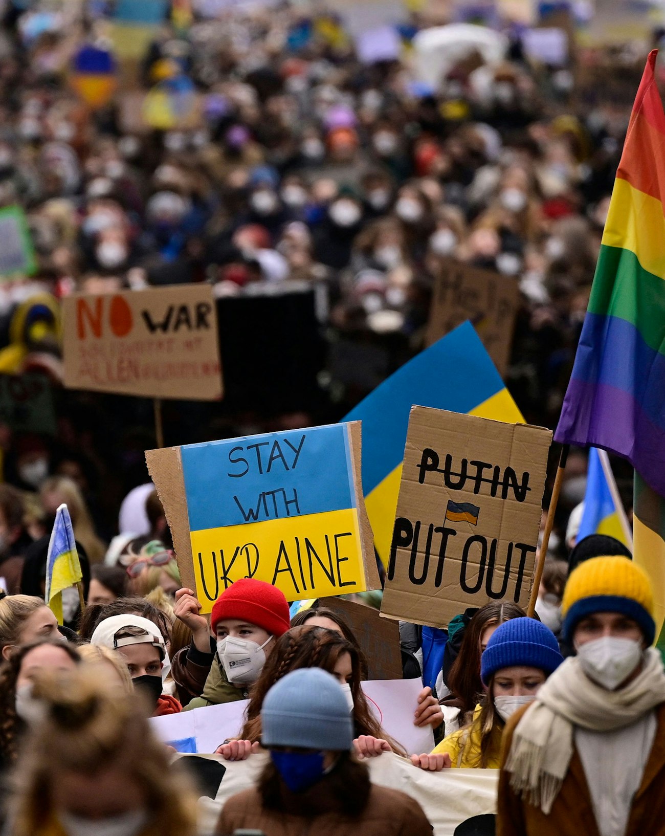 Demonstrators holding signs opposing to Russian invasion of Ukraine