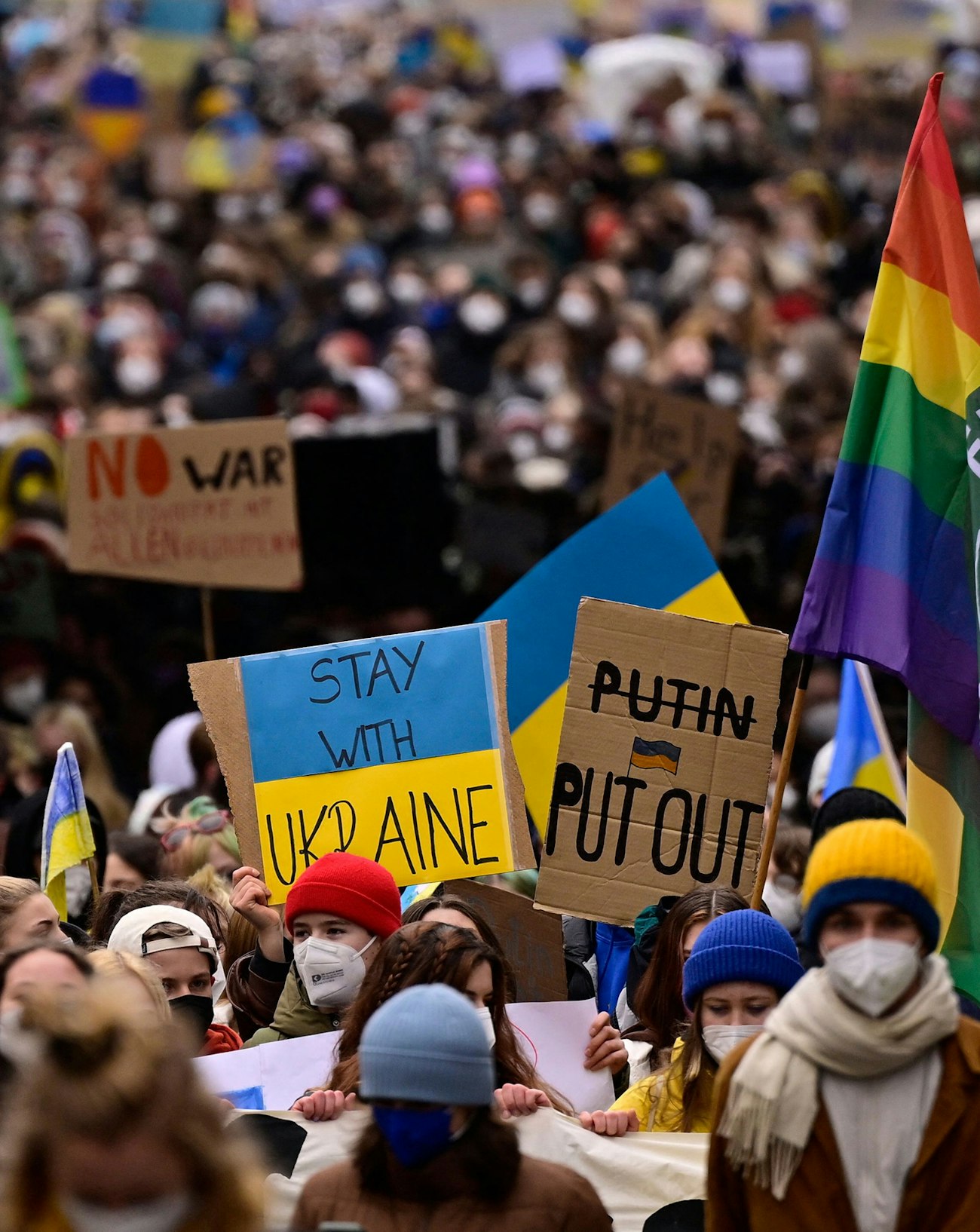 Demonstrators holding signs opposing to Russian invasion of Ukraine