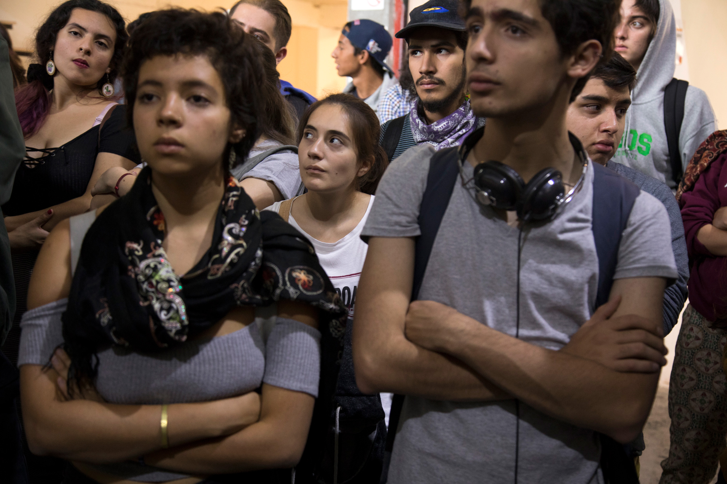 A group of students listen to a presentation