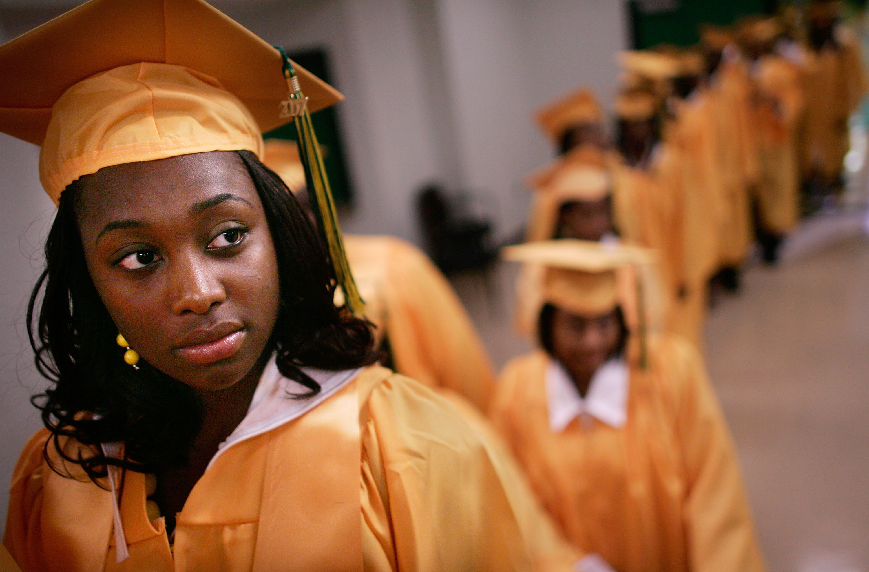 People in graduation caps and gowns