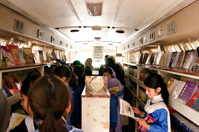 Children reading in mobile library.