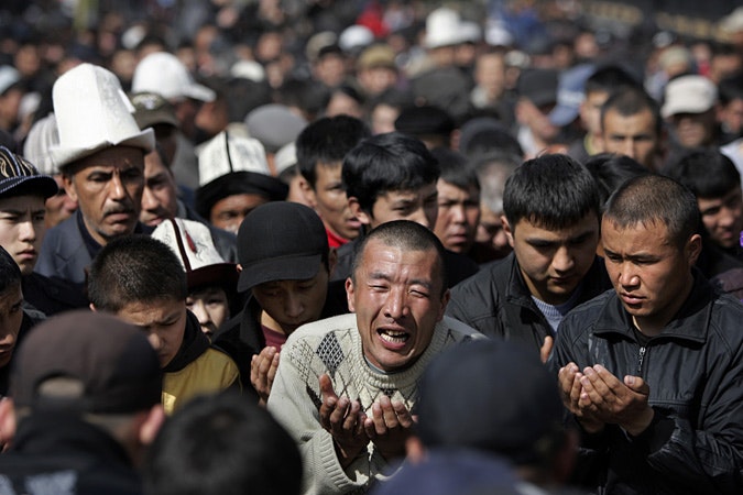 Large group of Kyrgyz pray